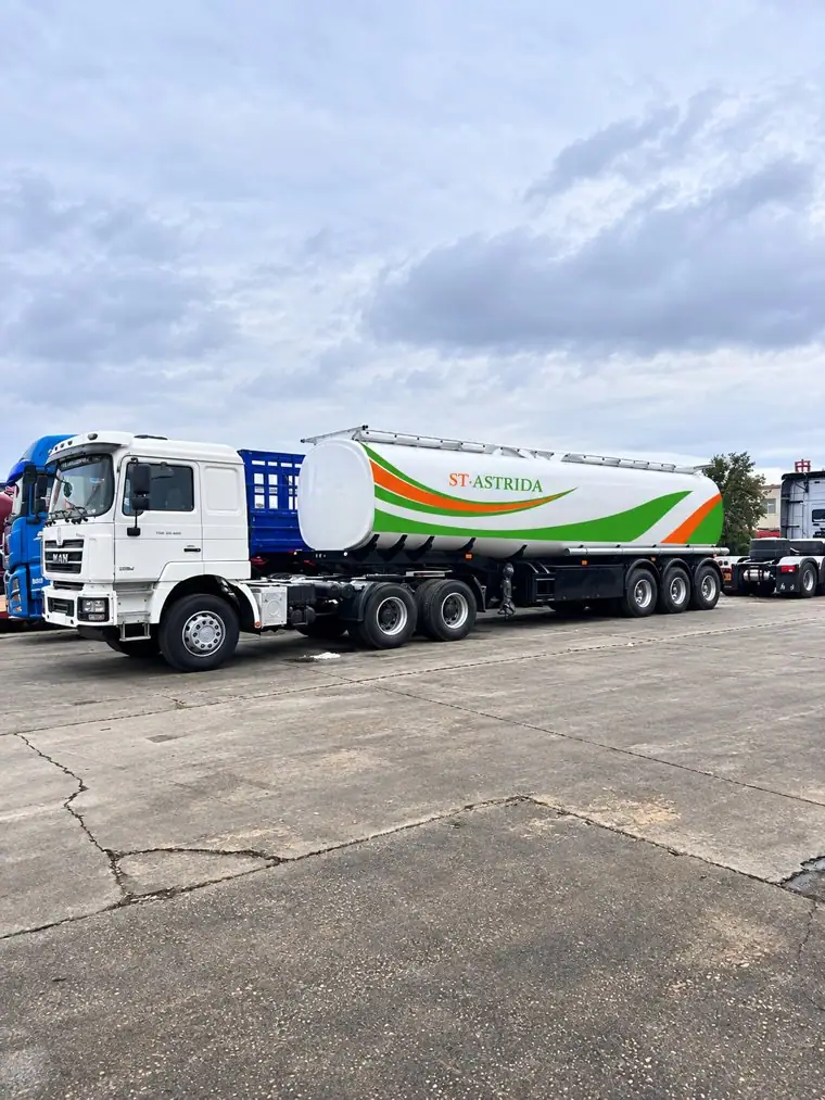 An ST·ASTRIDA fuel tanker parked in the yard